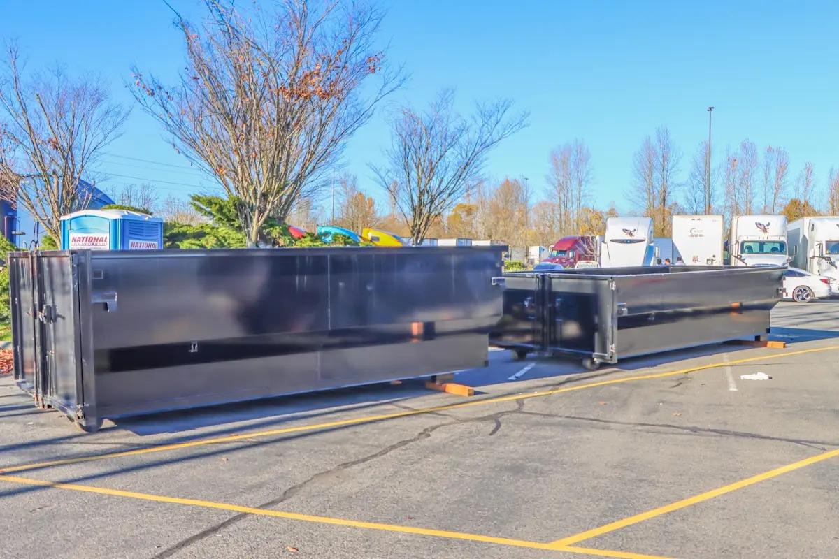 Professional dumpster rental service with roll-off container on residential driveway in Sweden